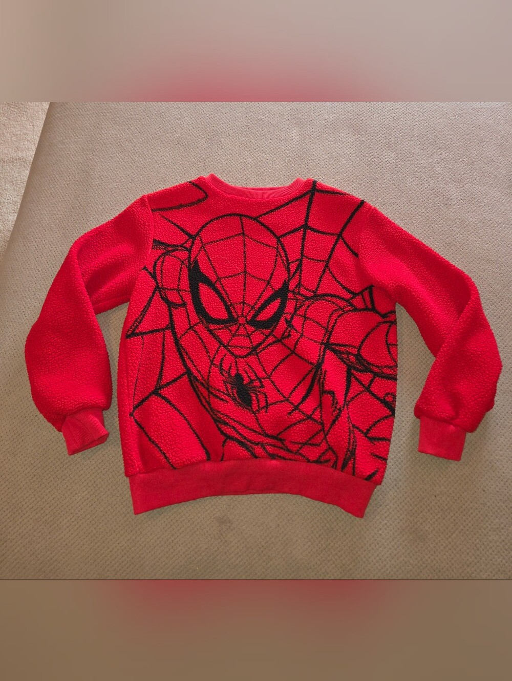 Marvel red fuzzy fleece Spider-Man crewneck sweatshirt featuring a large